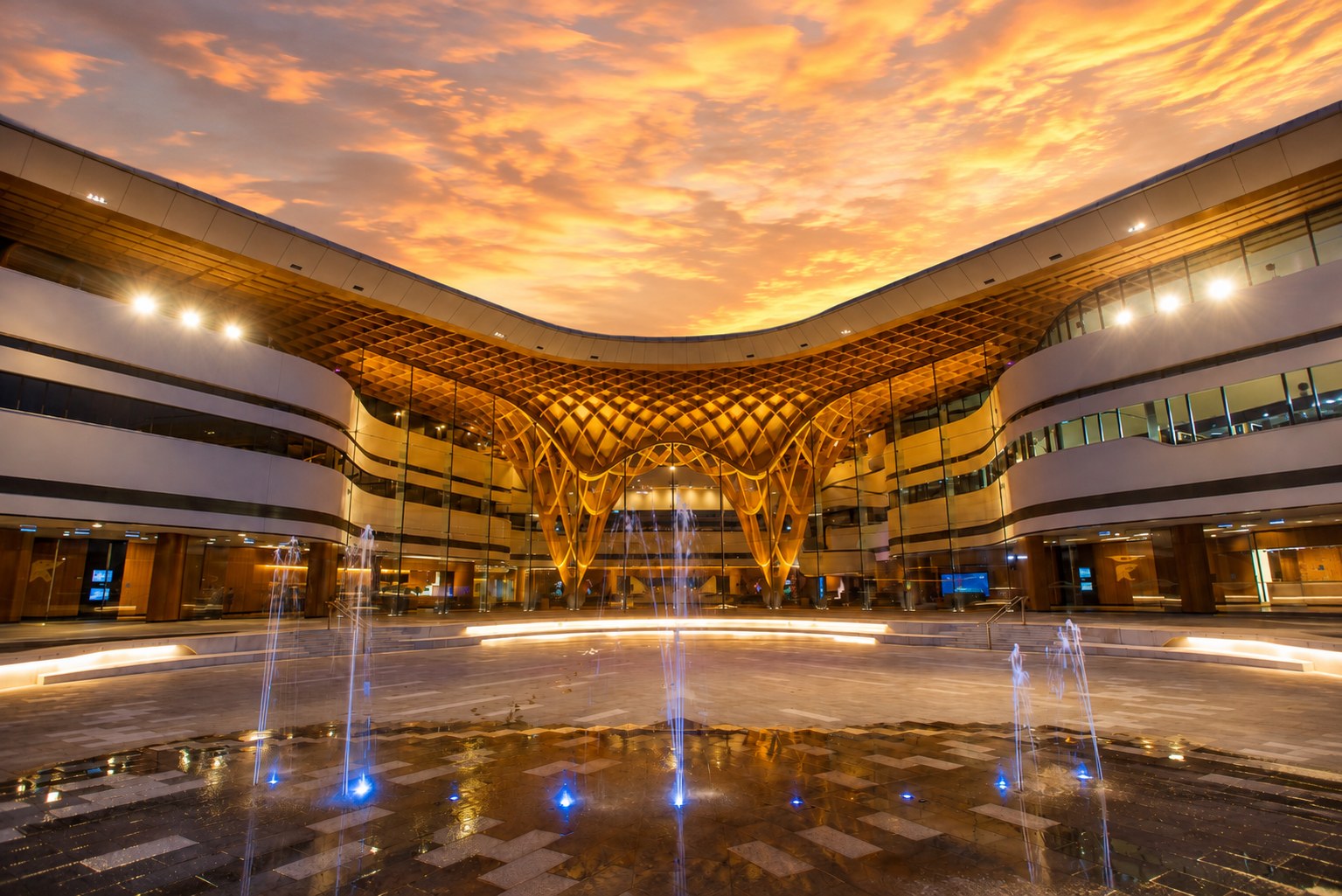 Bunjil Place in Narre Warren at sunset with illuminated architecture and fountains
